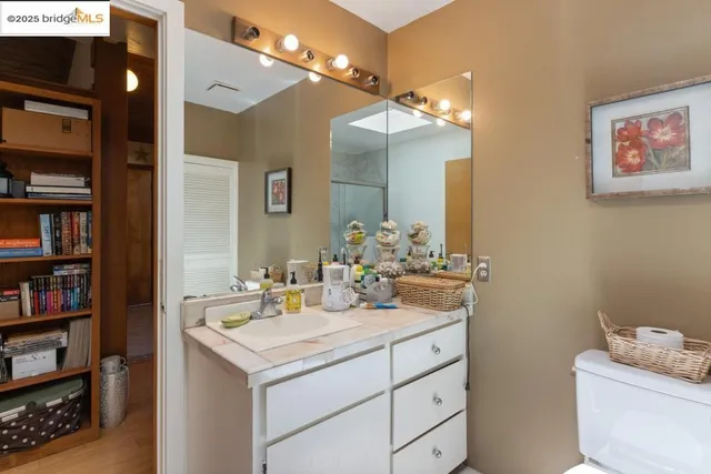 a bathroom with a sink double vanity and a mirror