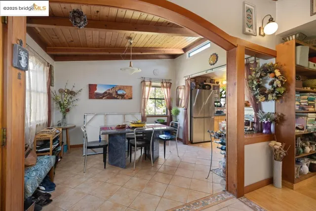 a dining hall with furniture and a window