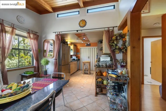 a kitchen with granite countertop lots of counter top space and stainless steel appliances