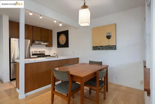 a kitchen with kitchen island a stove and a refrigerator