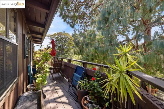 a backyard of a house with outdoor seating
