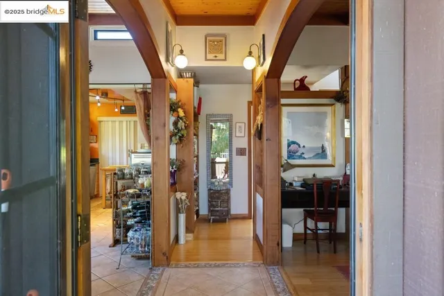 an entryway view with living room and dining room view