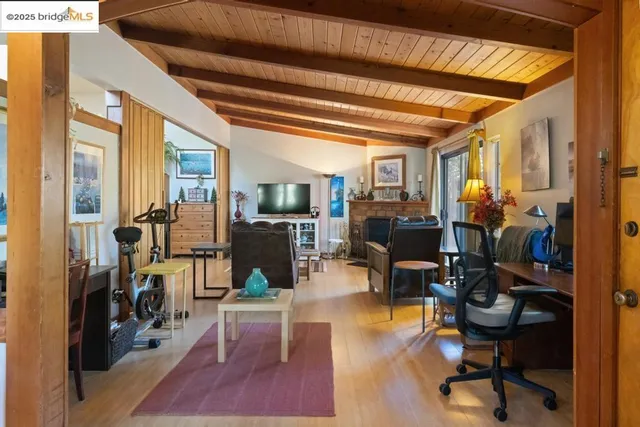 a view of a livingroom with furniture and a window