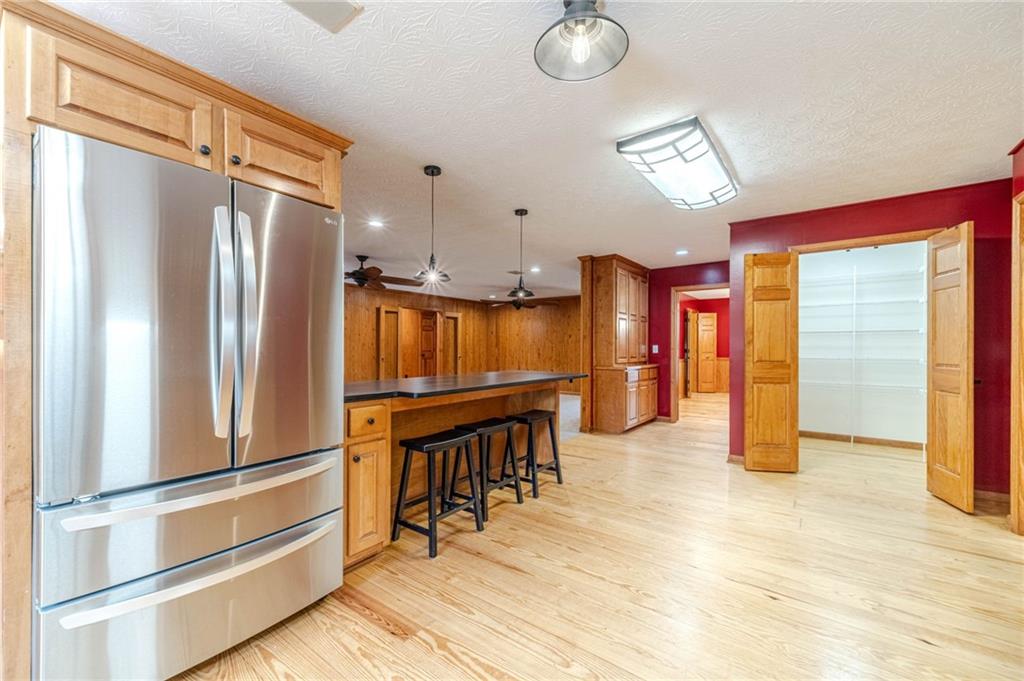 317 Duncan Road Oxford, GA 30054 - Photo 11 of 48 a kitchen with stainless steel appliances refrigerator oven table and chairs