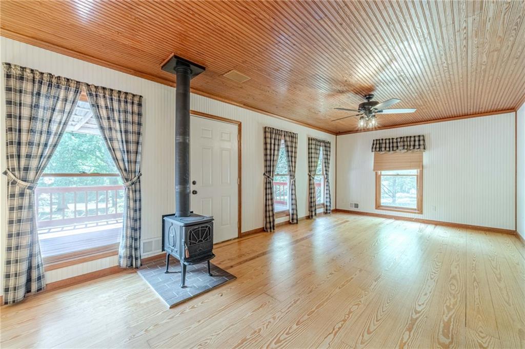 317 Duncan Road Oxford, GA 30054 - Photo 15 of 48 a view of a livingroom with wooden floor and a large window