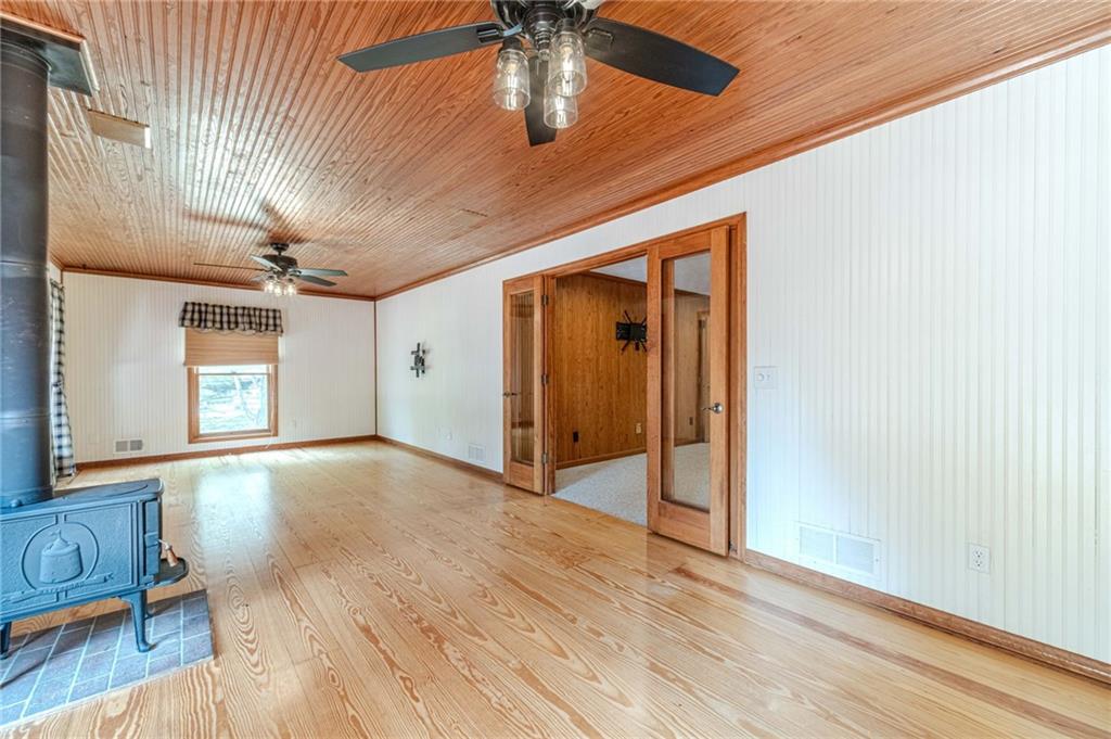 317 Duncan Road Oxford, GA 30054 - Photo 16 of 48 a view of an empty room with window and wooden floor