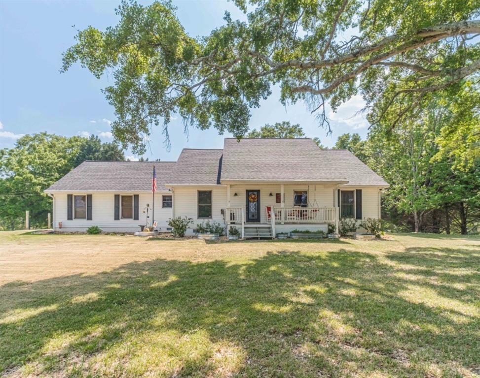 317 Duncan Road Oxford, GA 30054 - Photo 2 of 48 a front view of a house with a garden