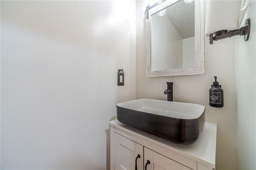 317 Duncan Road Oxford, GA 30054 - Photo 21 of 48 a bathroom with a sink and a mirror