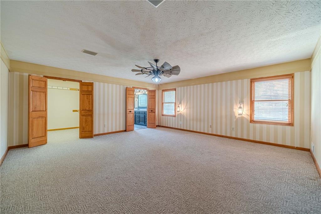 317 Duncan Road Oxford, GA 30054 - Photo 22 of 48 an empty room with windows and closet