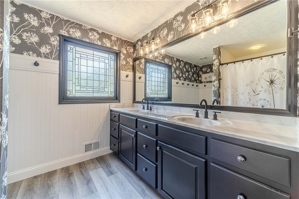 317 Duncan Road Oxford, GA 30054 - Photo 25 of 48 a bathroom with a granite countertop sink mirror and double