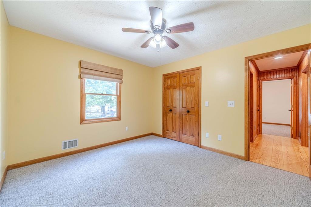 317 Duncan Road Oxford, GA 30054 - Photo 27 of 48 an empty room with windows and fan