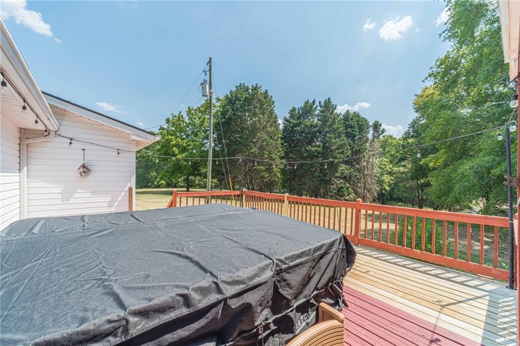 317 Duncan Road Oxford, GA 30054 - Photo 32 of 48 a view of a roof deck with wooden floor and fence