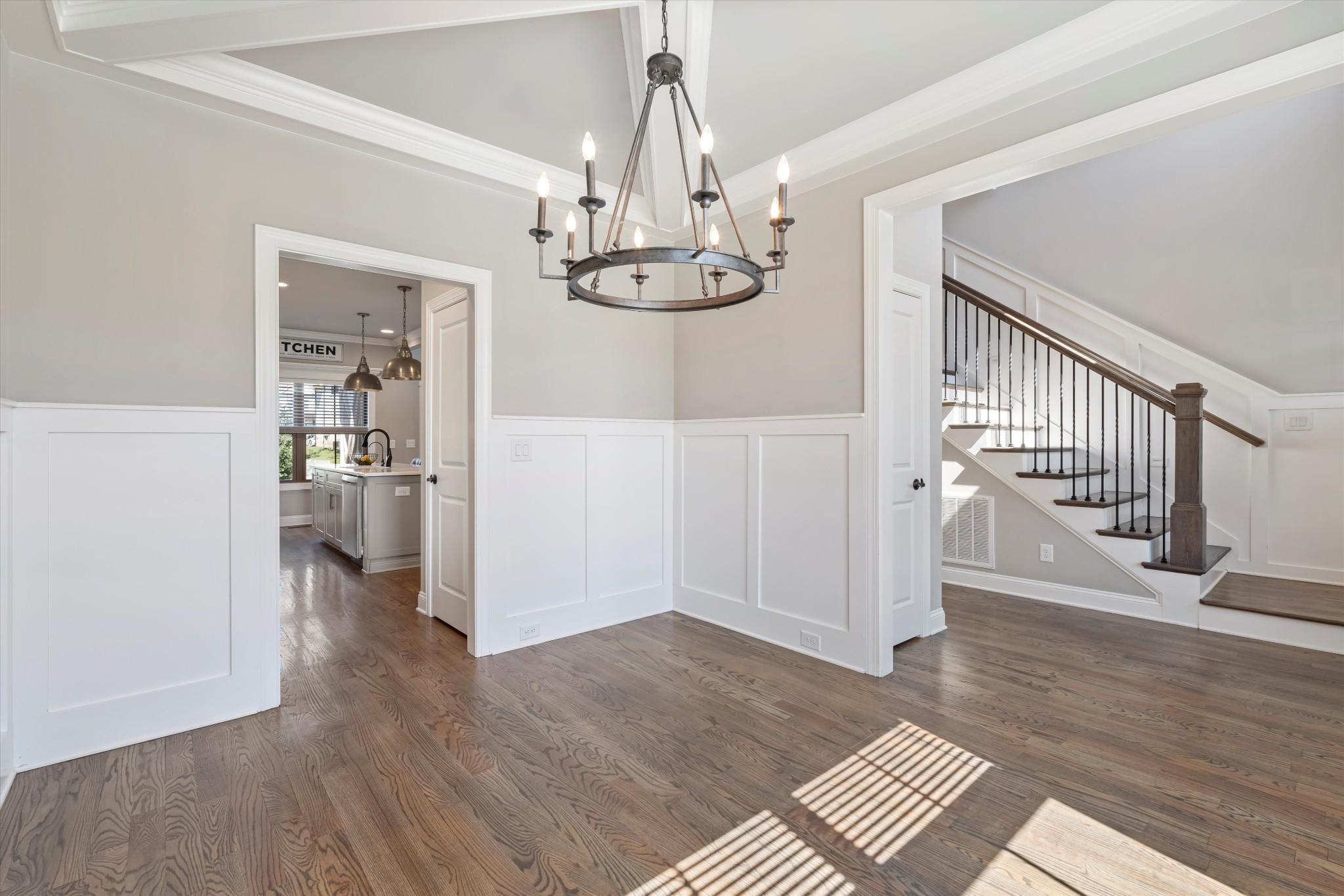 1706 Sorrell Pk Drive Spring Hill, TN 37174 - Photo 16 of 50 a view of a hallway with wooden floor and chandelier