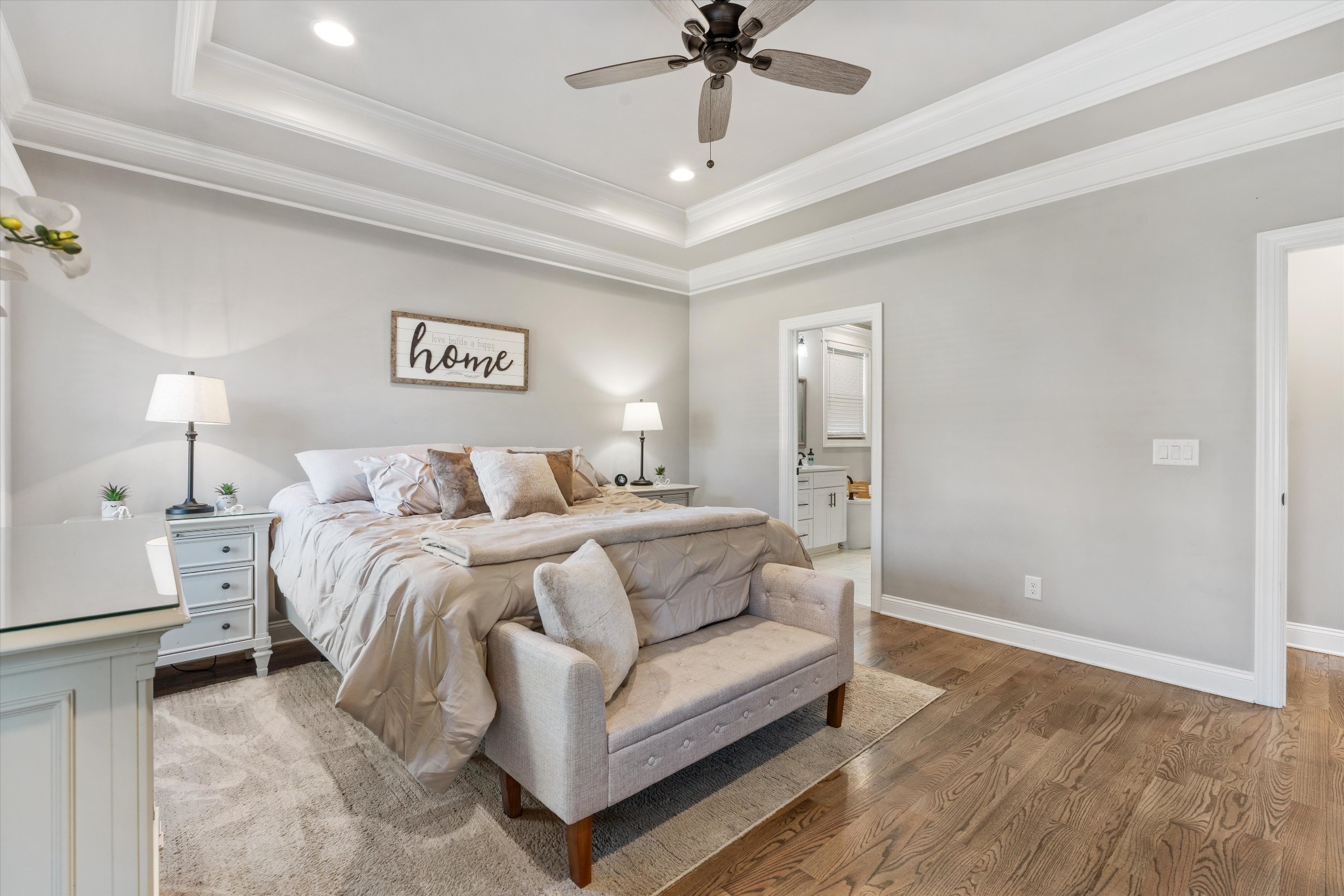 1706 Sorrell Pk Drive Spring Hill, TN 37174 - Photo 21 of 50 a spacious bedroom with a bed and a chandelier