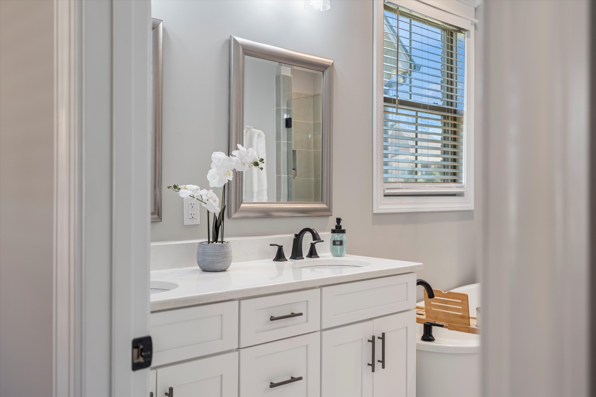 1706 Sorrell Pk Drive Spring Hill, TN 37174 - Photo 22 of 50 a bathroom with a sink and a mirror