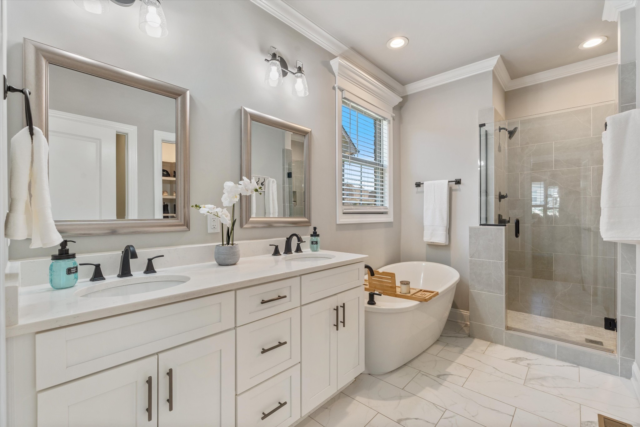 1706 Sorrell Pk Drive Spring Hill, TN 37174 - Photo 23 of 50 a bathroom with a double vanity sink toilet mirror and bathtub