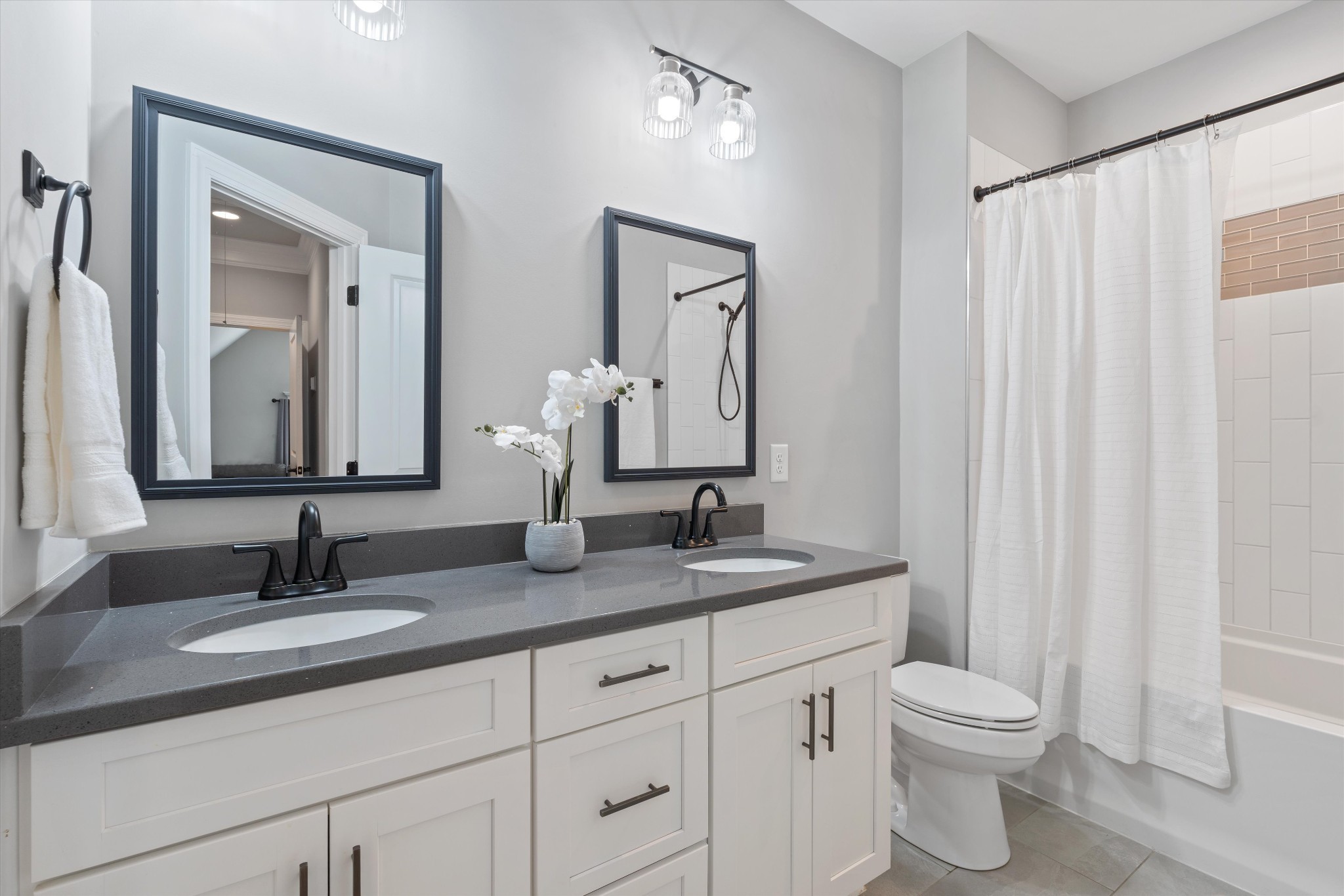 1706 Sorrell Pk Drive Spring Hill, TN 37174 - Photo 27 of 50 a bathroom with a double vanity sink and a mirror