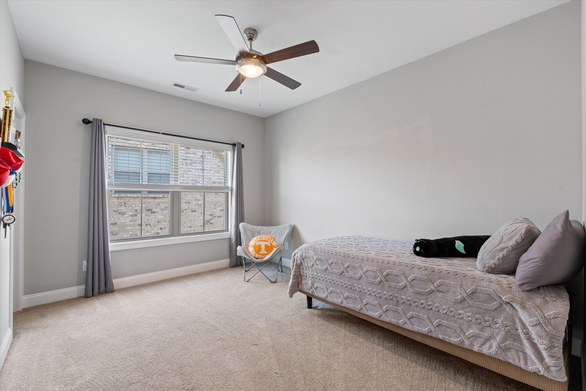 1706 Sorrell Pk Drive Spring Hill, TN 37174 - Photo 30 of 50 a bedroom with a bed a window and couch