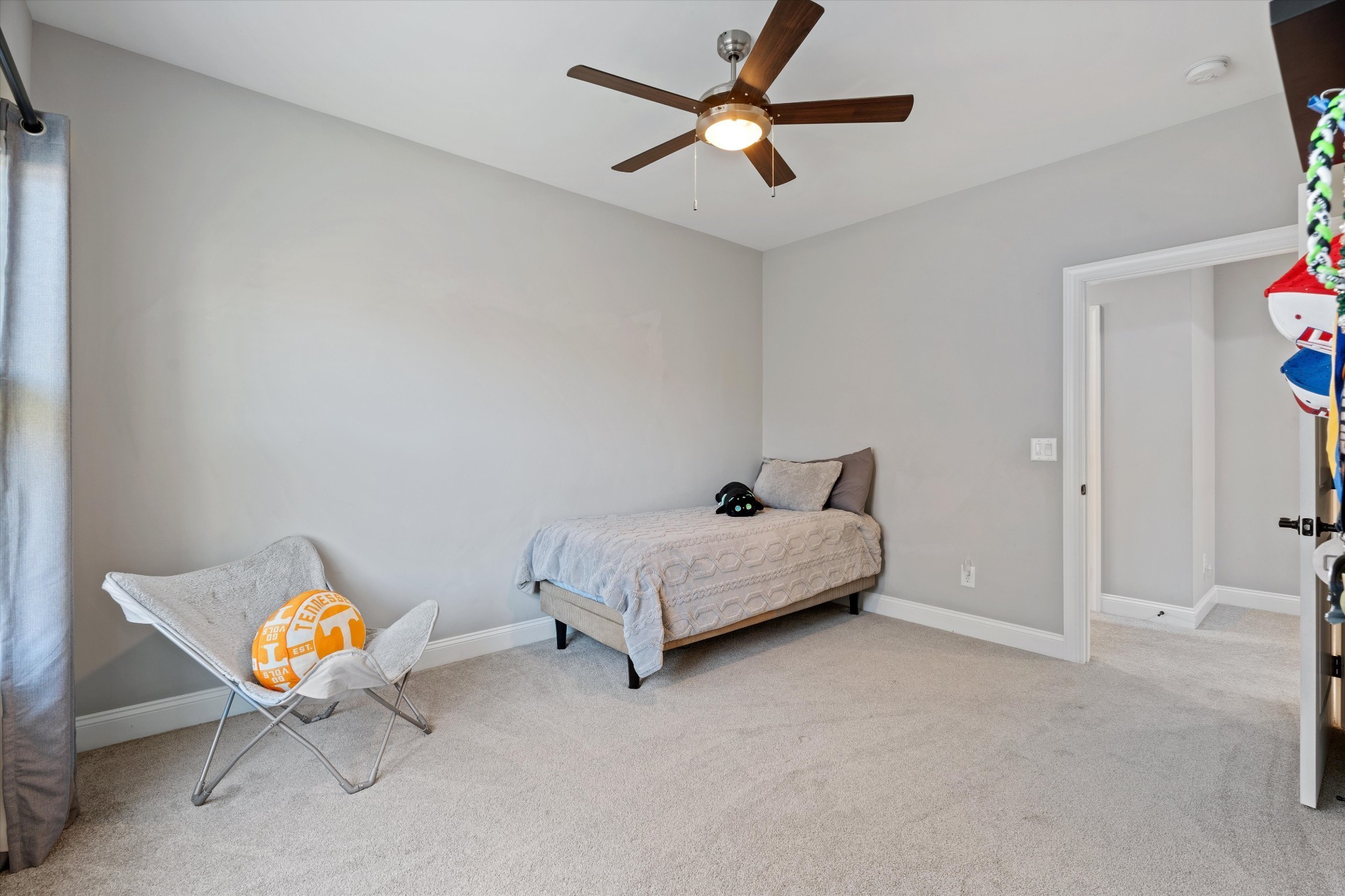 1706 Sorrell Pk Drive Spring Hill, TN 37174 - Photo 31 of 50 a bedroom with a bed and a chandelier