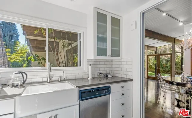 a bathroom with a sink and a large mirror