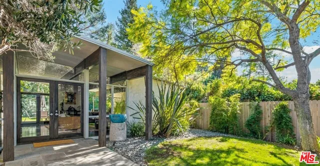 a backyard of a house with lots of green space
