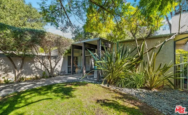 a view of a house with a tree