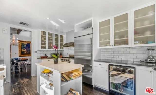 a kitchen with stainless steel appliances granite countertop a stove and a sink