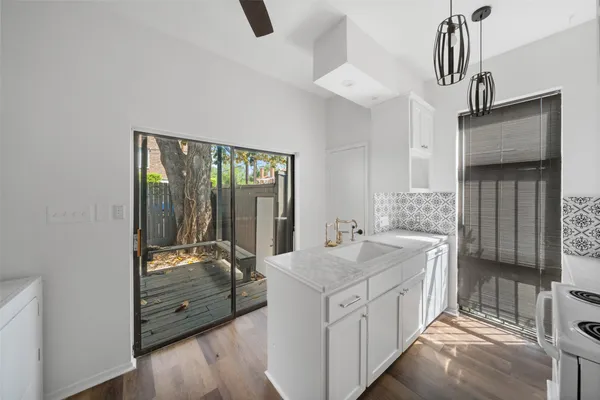 a room with sink washer and dryer