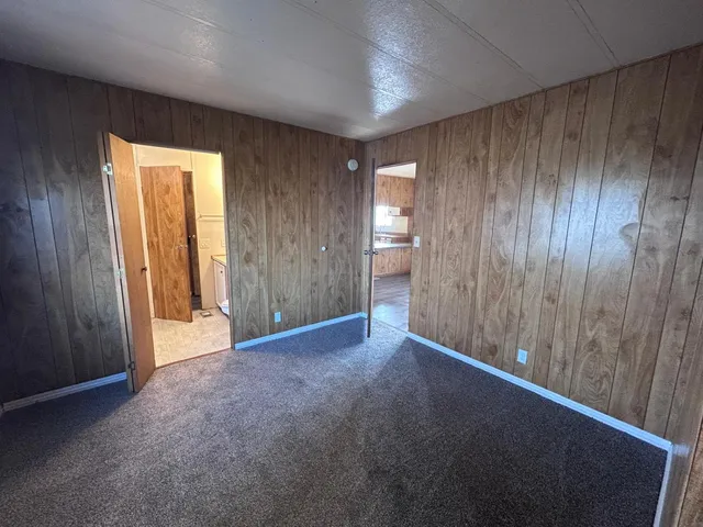 a view of an empty room and a window