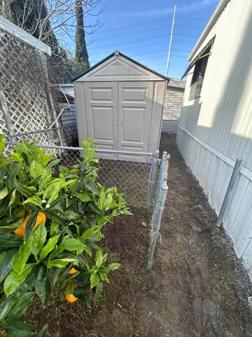 a view of a backyard with pathway