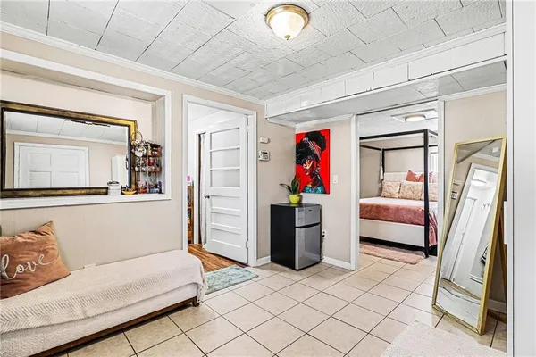 a bedroom with furniture and a window