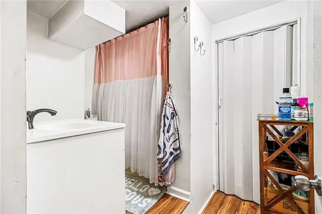 a view of an entryway with wooden floor