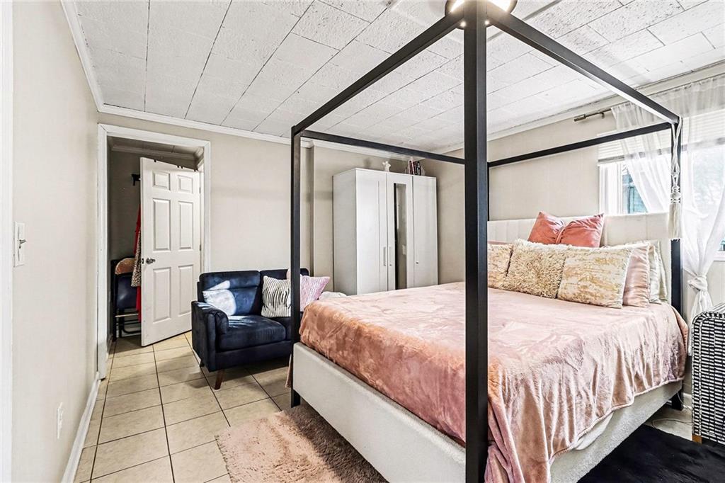 6186 Deans Way Morrow, GA 30260 - Photo 16 of 35 a bedroom with a bed and glass door