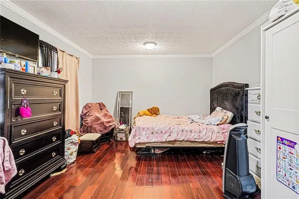 a bed room with a bed and a tv