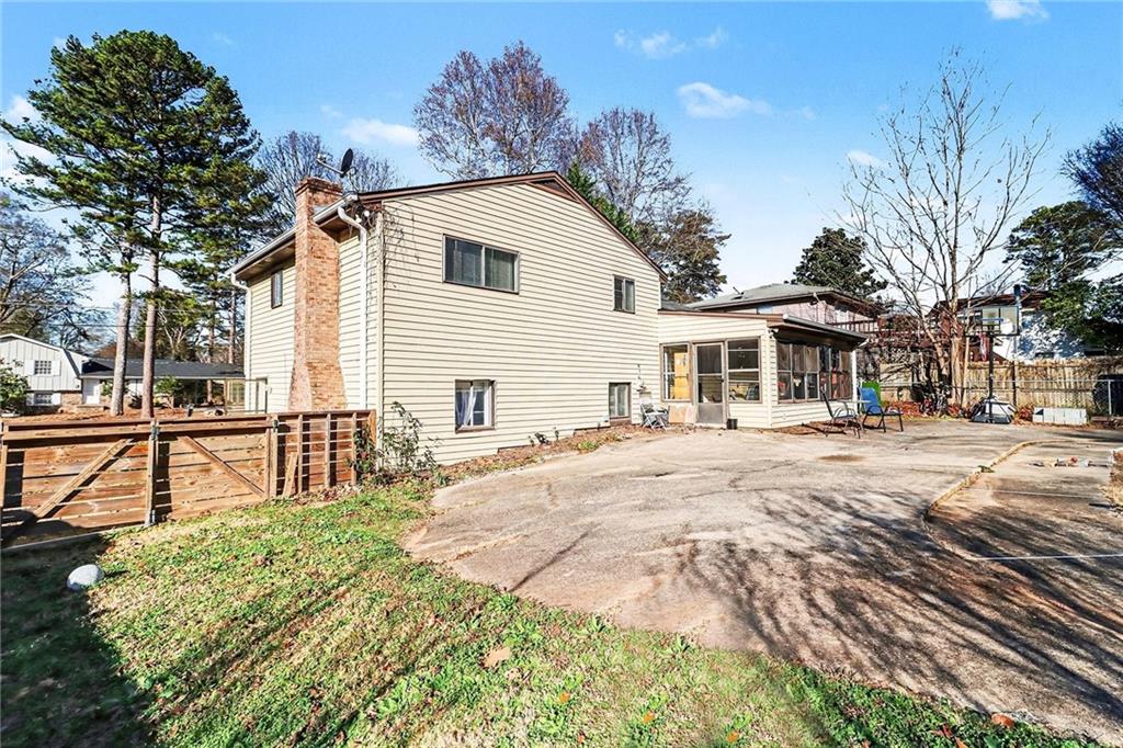 6186 Deans Way Morrow, GA 30260 - Photo 31 of 35 a patio with table and chairs and potted plants