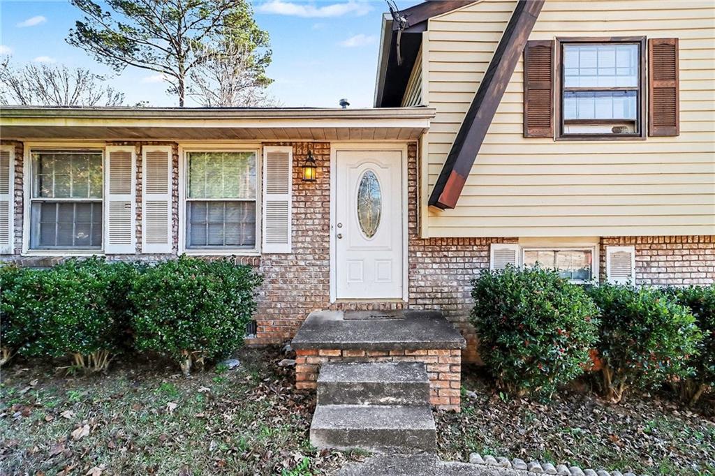 6186 Deans Way Morrow, GA 30260 - Photo 5 of 35 a front view of a house with a garden