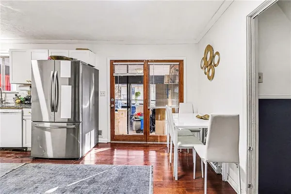 a view of kitchen with furniture wooden floor and window
