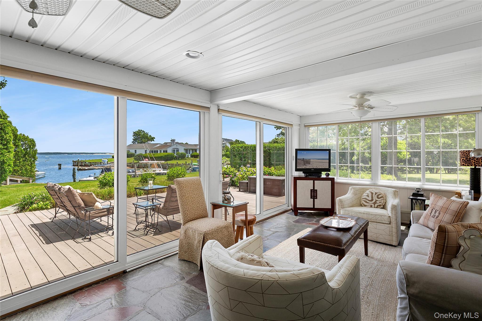 315 Old Salt Road Mattituck, NY 11952 - Photo 6 of 22 a living room with furniture and large windows