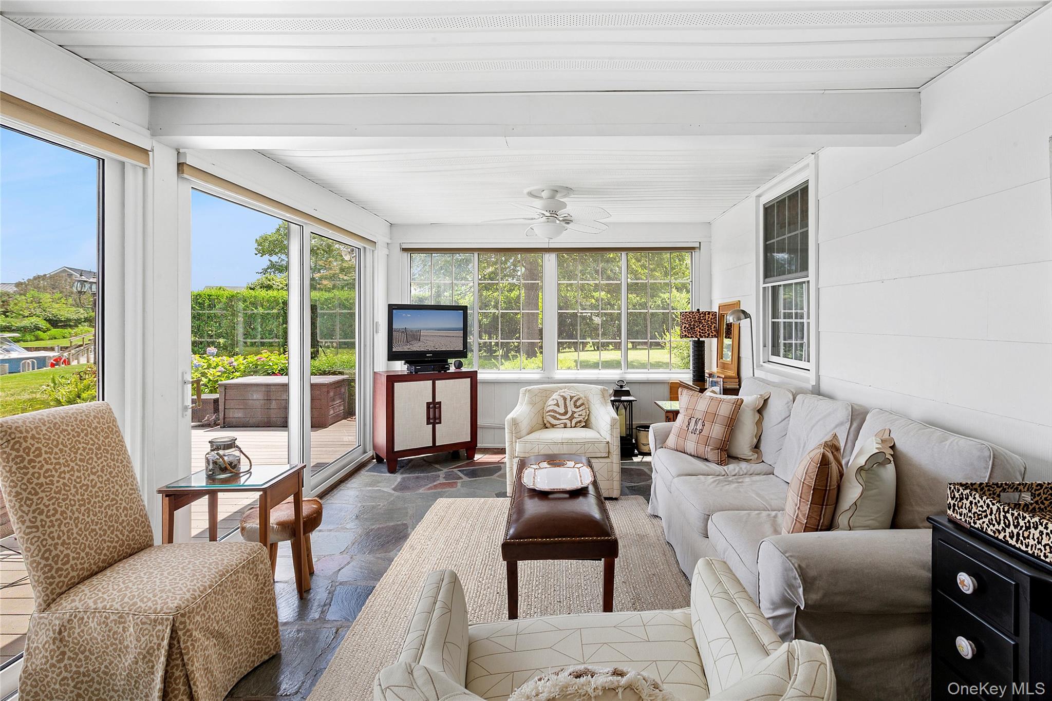 315 Old Salt Road Mattituck, NY 11952 - Photo 7 of 22 a living room with furniture and large windows