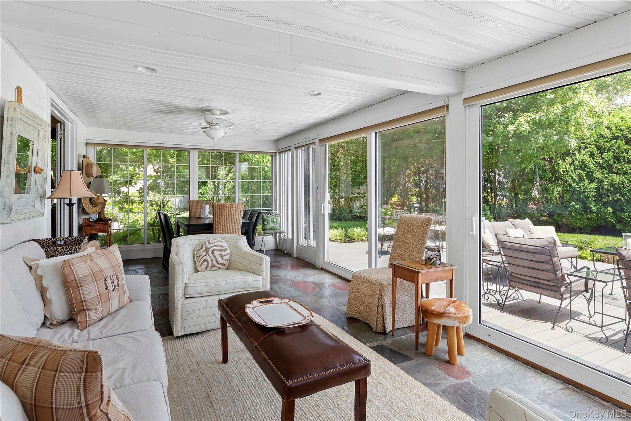 315 Old Salt Road Mattituck, NY 11952 - Photo 8 of 22 a living room with furniture and a floor to ceiling window