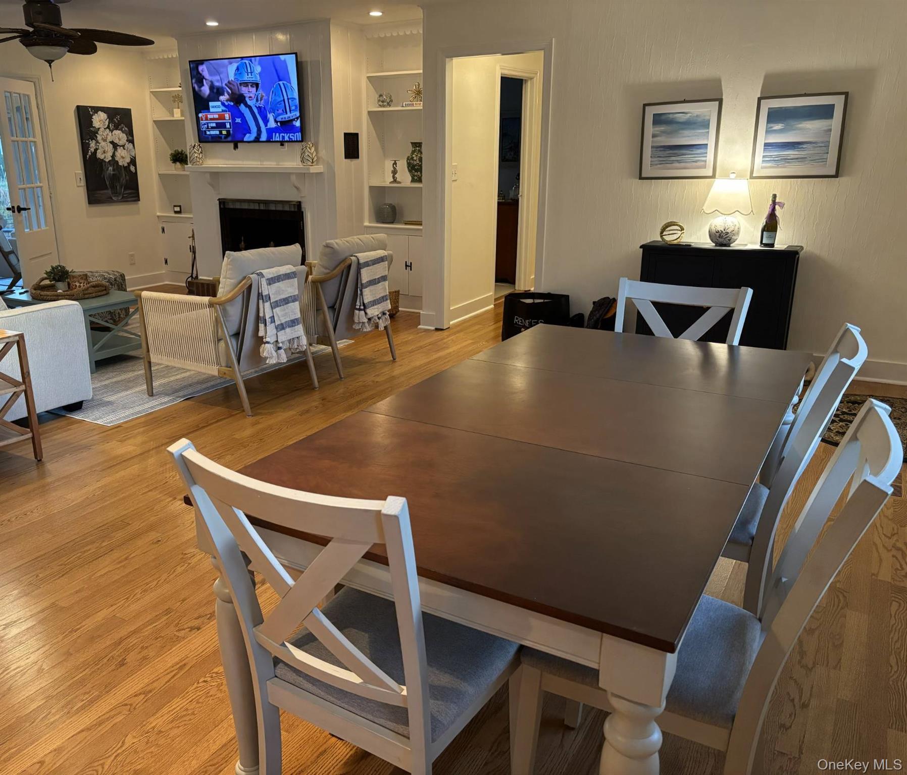 315 Old Salt Road Mattituck, NY 11952 - Photo 10 of 22 a living room with furniture a fireplace and a flat screen tv