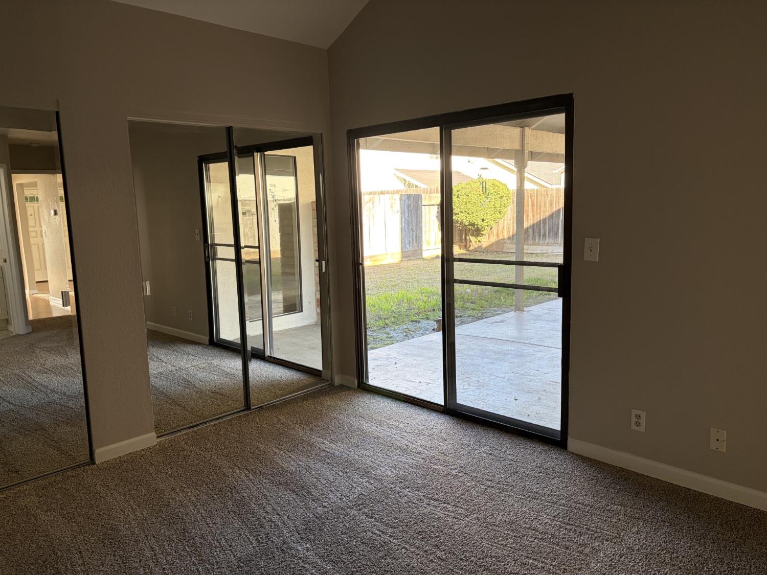 2401 Walnut Grove Way Modesto, CA 95355 - Photo 11 of 25 a view of empty room with floor to ceiling window