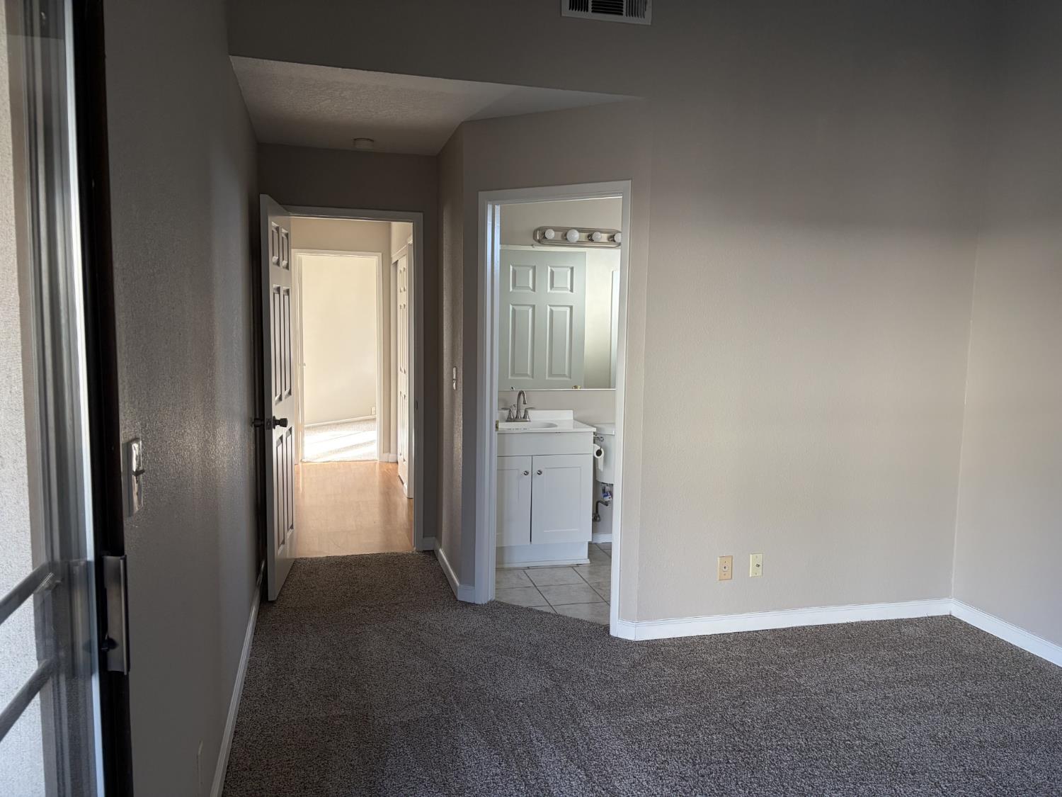 2401 Walnut Grove Way Modesto, CA 95355 - Photo 12 of 25 a view of a room with an entryway and wooden floor