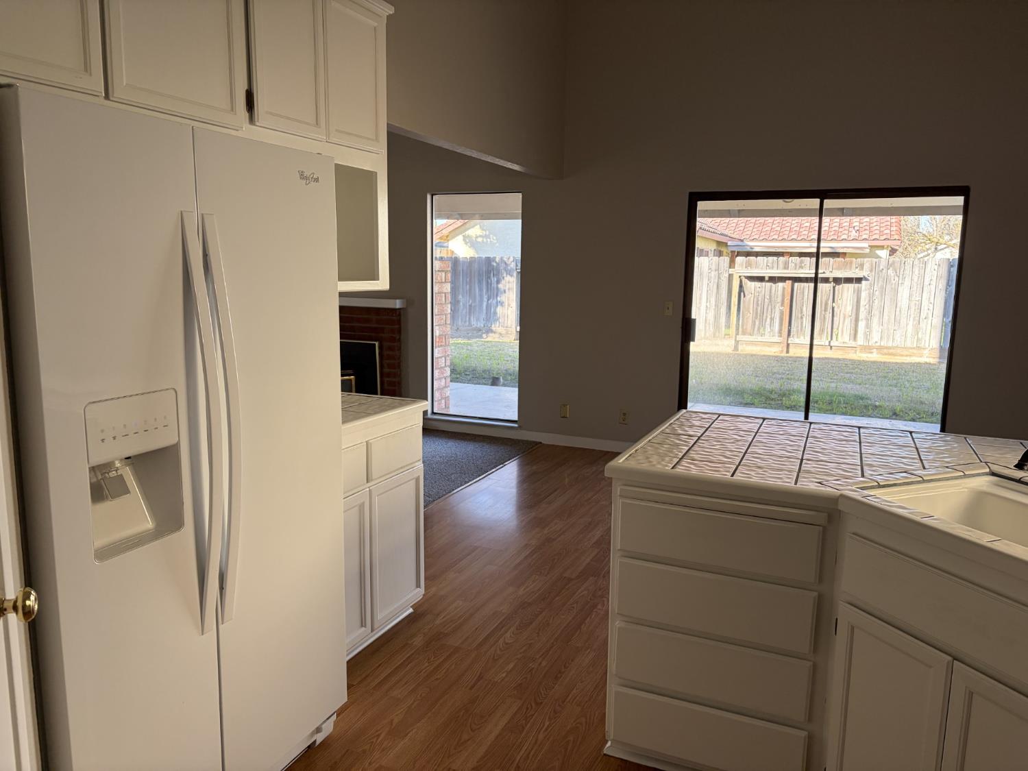 2401 Walnut Grove Way Modesto, CA 95355 - Photo 10 of 25 a room with a door and wooden floors