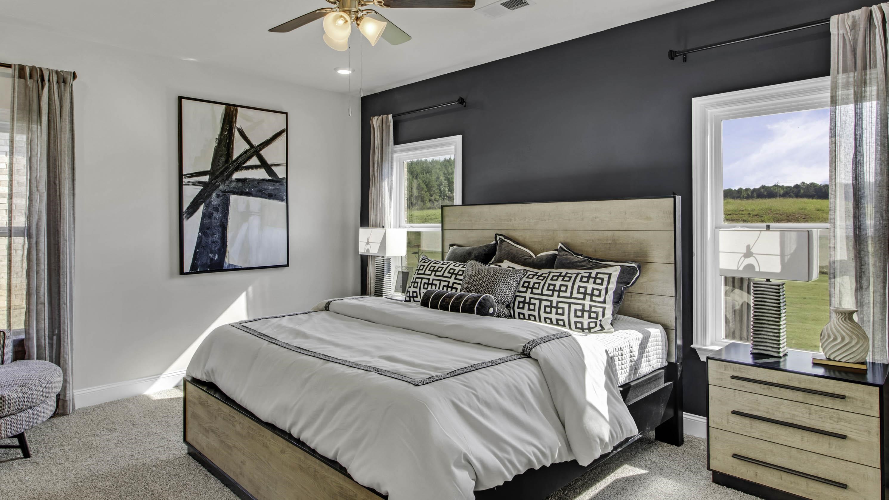 1010 Mewborn Farm Road Oakland, TN 38060 - Photo 14 of 40 a bedroom with a bed and a painting on the wall