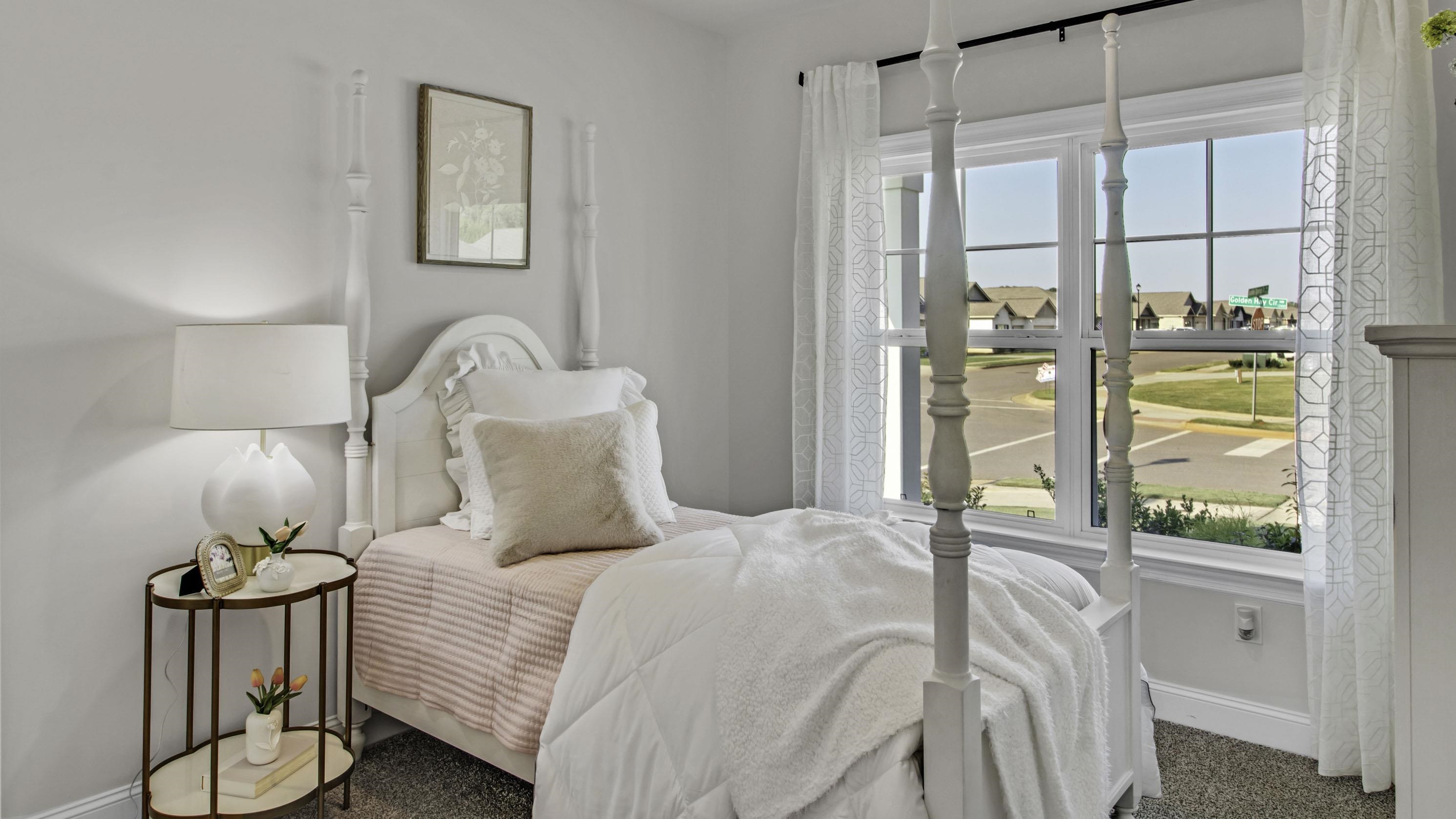 1010 Mewborn Farm Road Oakland, TN 38060 - Photo 21 of 40 a bedroom with a bed and a painting on the wall