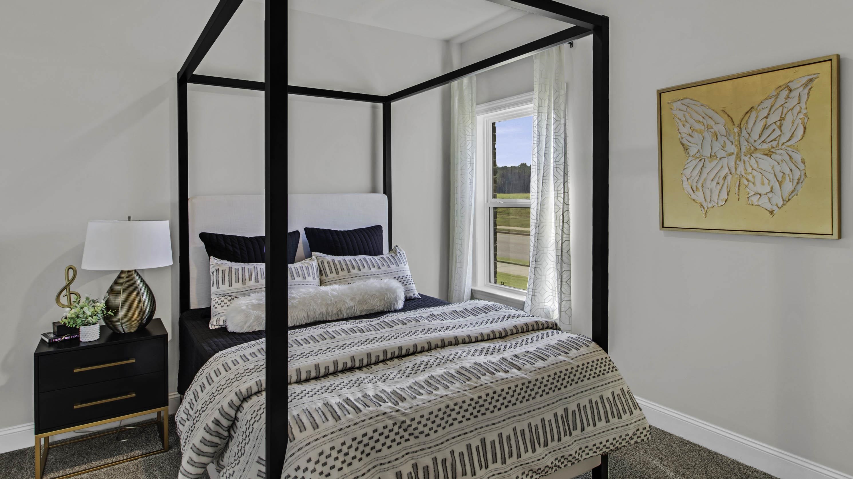 1010 Mewborn Farm Road Oakland, TN 38060 - Photo 25 of 40 a bedroom with a large bed and a painting on the wall