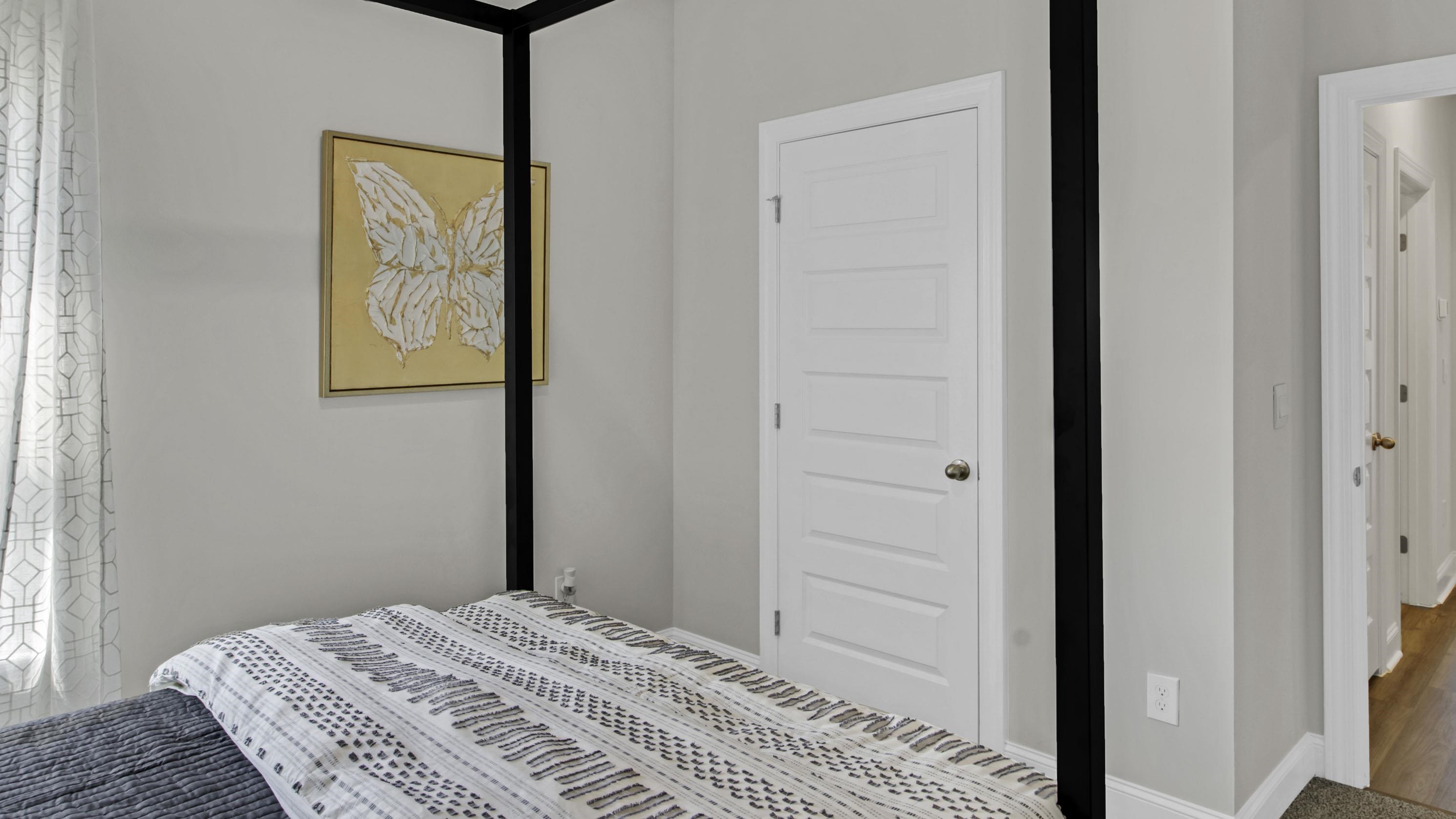 1010 Mewborn Farm Road Oakland, TN 38060 - Photo 26 of 40 a view of a bedroom with a bed and wooden floor