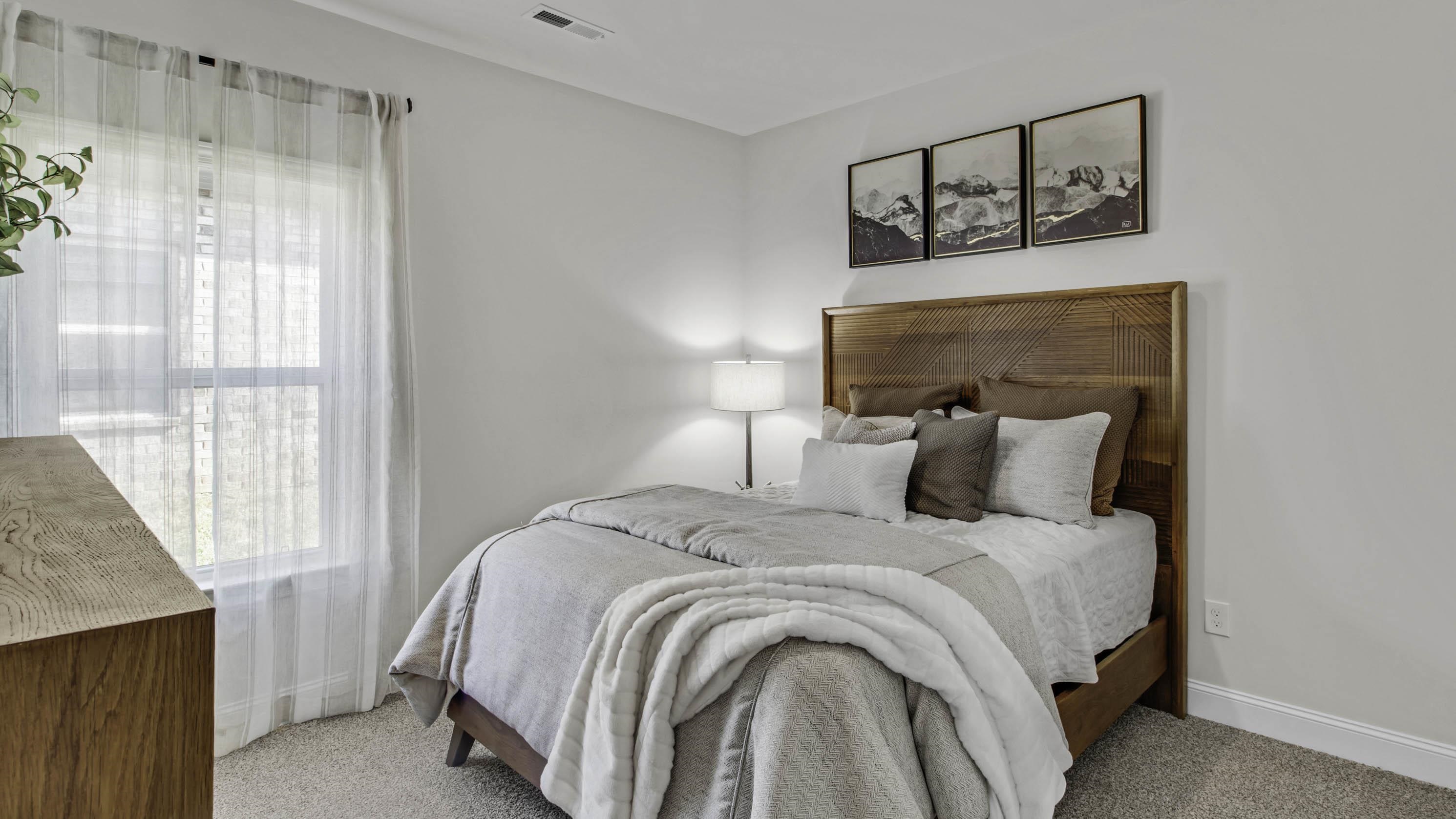 1010 Mewborn Farm Road Oakland, TN 38060 - Photo 29 of 40 a bedroom with a bed and a window