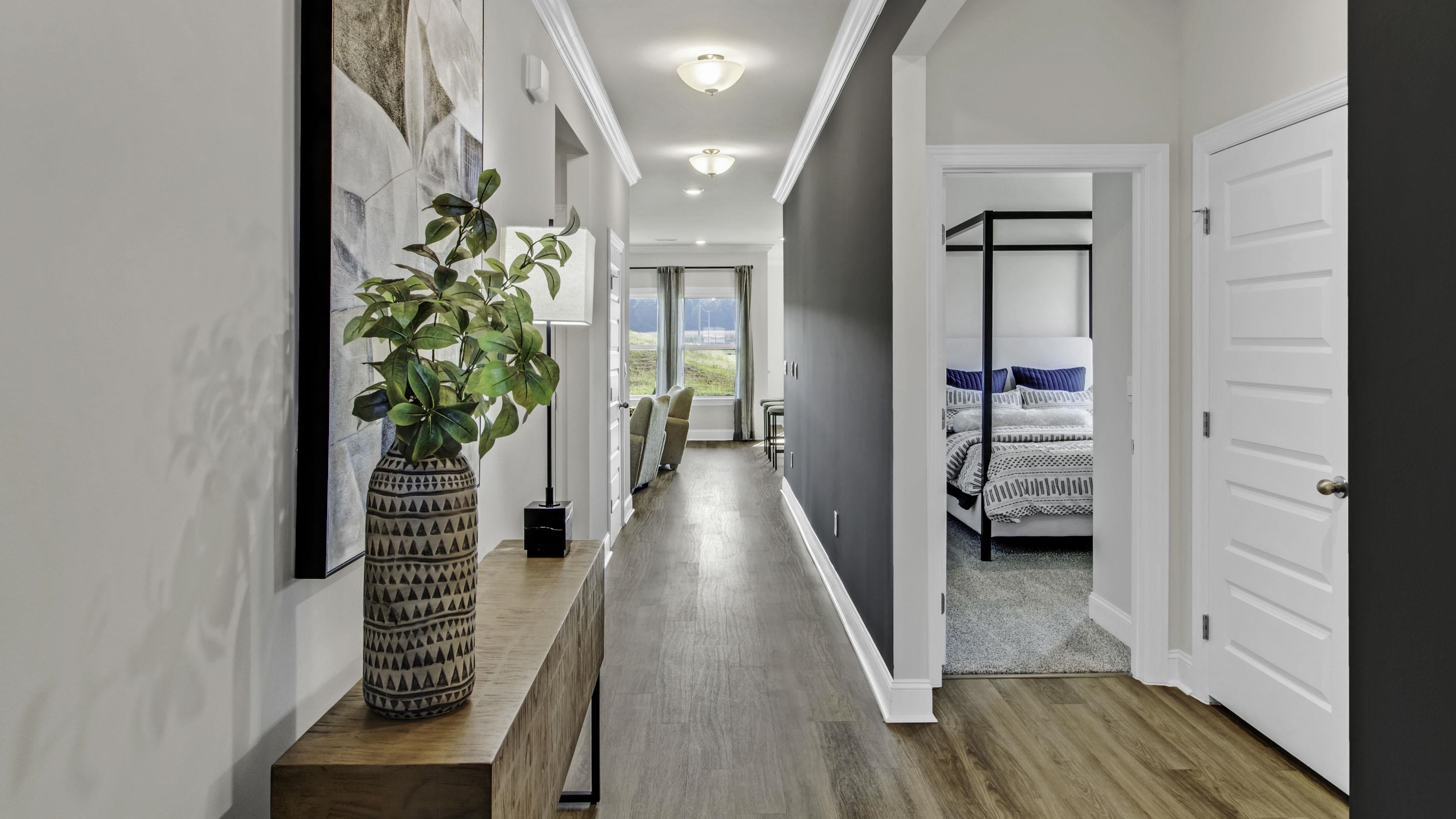 1010 Mewborn Farm Road Oakland, TN 38060 - Photo 3 of 40 a view of a hallway with wooden floor and stairs
